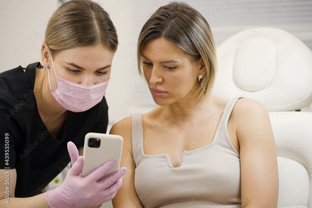 Doctor showing results of therapy to the patient Doctor showing results of therapy to the patient