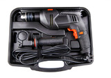 Electric drill in a suitcase. Keyless chuck. Gear teeth. Close-up tool. Metal details. Worker mechanics and tools
