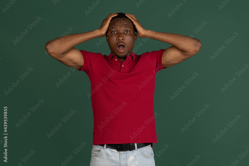 Wow. Beautiful male half-length front portrait isolated on studio backgroud. Young emotional surprised man standing with open mouth. Human emotions concept. Wow. Beautiful male half-length front portrait isolated on studio backgroud. Young emotional surprised man standing with open mouth. Human emotions concept.