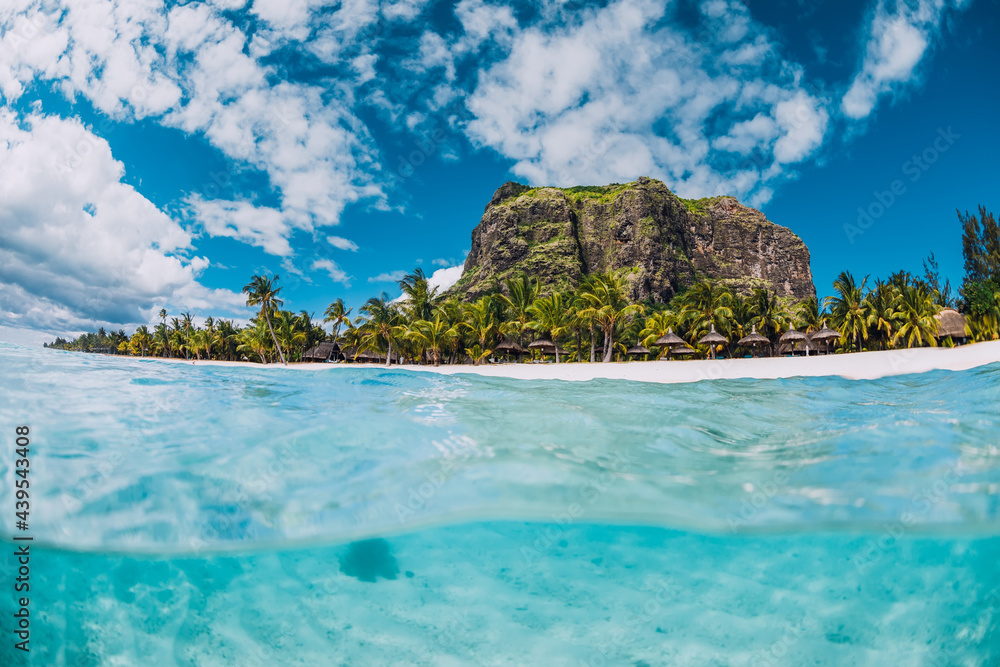 Tropical transparent ocean with Le Morne mountain and beach in Mauritius.