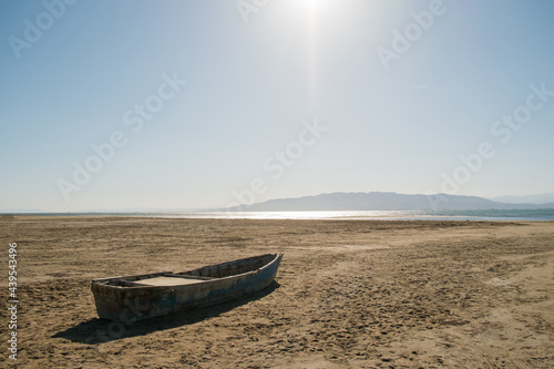 A boat stranded on the sand photo