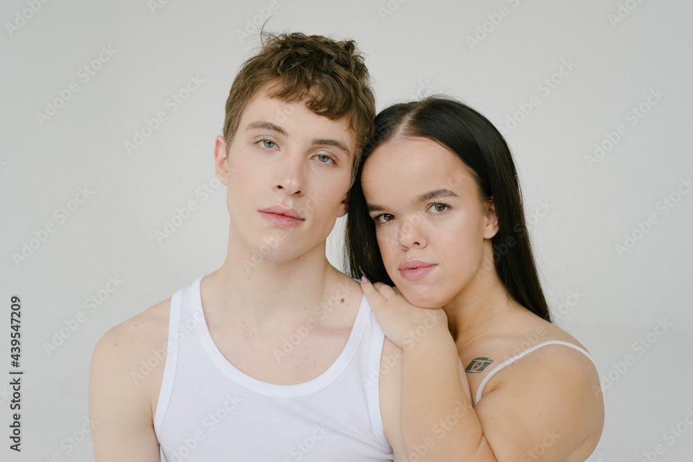 Androgynous man and Young dwarf woman in studio Androgynous man and Young dwarf woman in studio