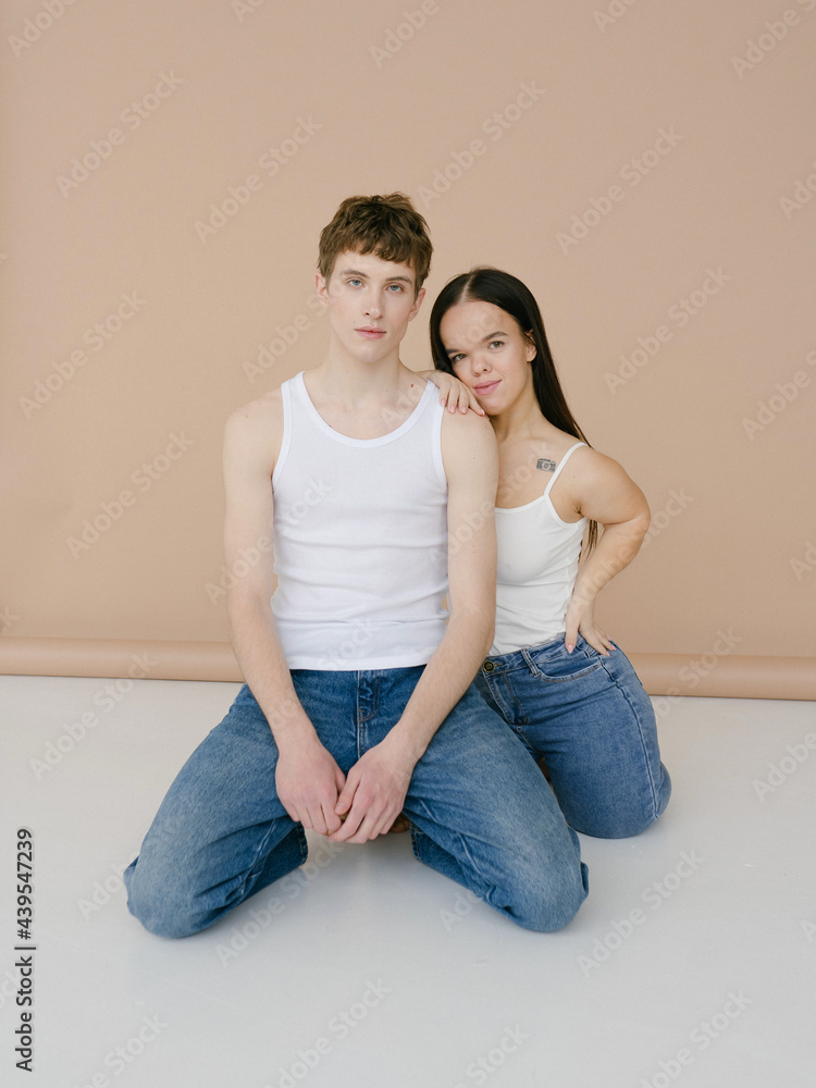 Androgynous man and Young dwarf woman in studio Androgynous man and Young dwarf woman in studio