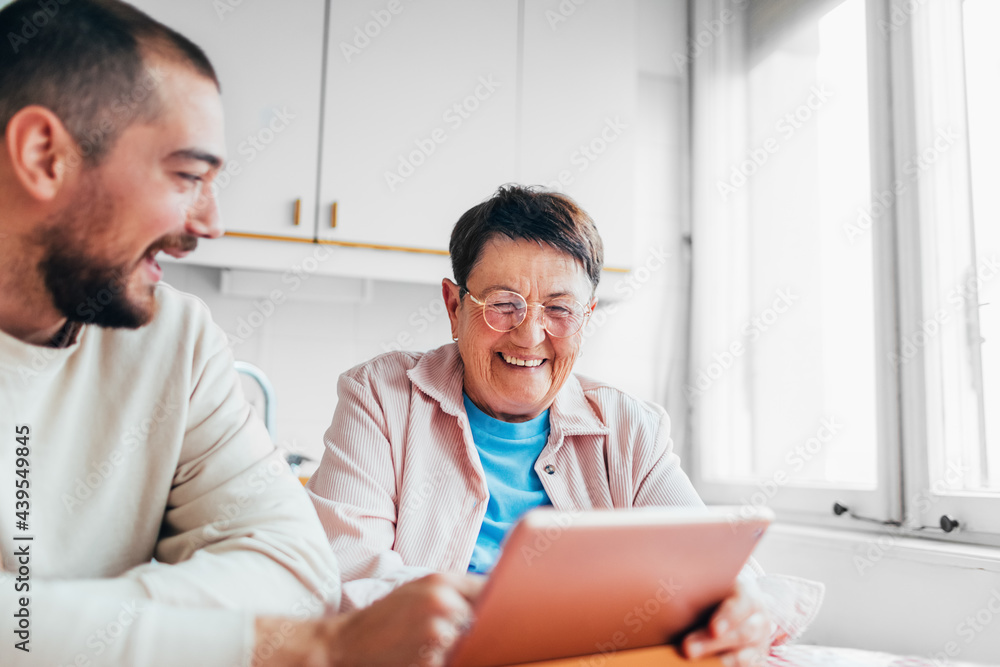 A Senior Lady and Her Grandson at Home A Senior Lady and Her Grandson at Home