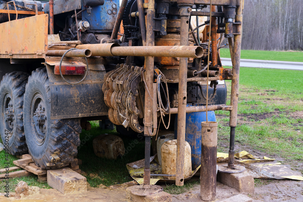Drilling the earth to take samples of soil layers for geology Drilling the earth to take samples of soil layers for geology