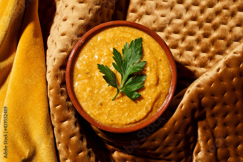 korma curry sauce in an earthenware bowl photo
