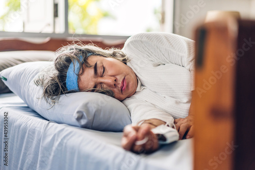 Senior asian woman sleeping and close eye.elderly woman felling relaxing and enjoy time on the bed at home