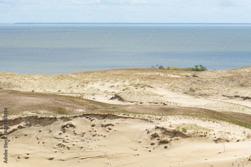 Panoramic view of sand dunes in Nida, Klaipeda, Lithuania, Europe. Curonian Spit and Curonian Lagoon. Baltic Dunes on the Baltic Sea. Unesco heritage Panoramic view of sand dunes in Nida, Klaipeda, Lithuania, Europe. Curonian Spit and Curonian Lagoon. Baltic Dunes on the Baltic Sea. Unesco heritage