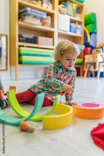 Children playing alone in kindergarten