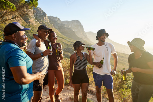 Friends outdoors having a sundowner photo