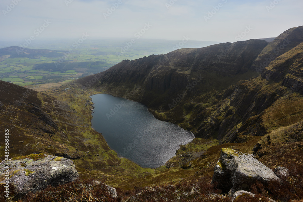 lake from a glacier buried in a mountainous valley. Comeragh Mountains, Waterford, Ireland