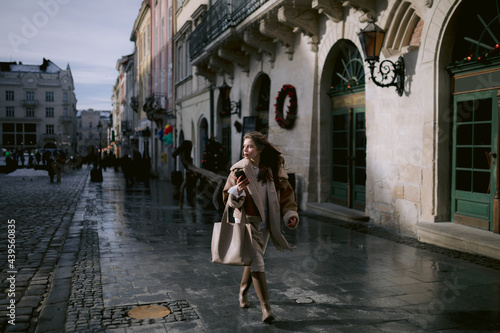 Girl strolling in city centre  photo