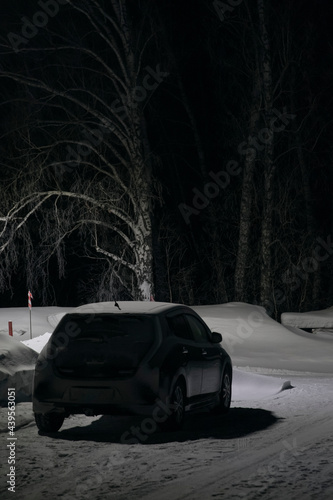 Car parked in snowy countryside