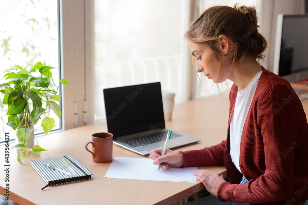 Student girl doing homework in her home Student girl doing homework in her home