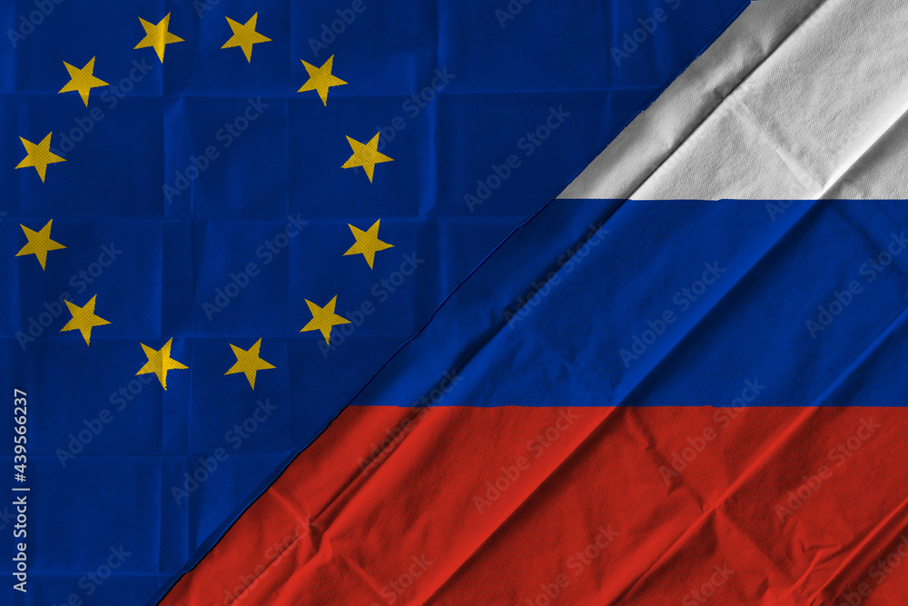 Concept of the relationship between the European Union (EU) and Russia with two flags over each other Concept of the relationship between the European Union (EU) and Russia with two flags over each other