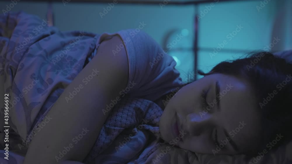 A Young Woman Lies in Bed at Night and Cannot Sleep. Millennial Woman have trouble sleeping Girl have difficulty falling asleep. Insomnia a Sleep Disorder Concept