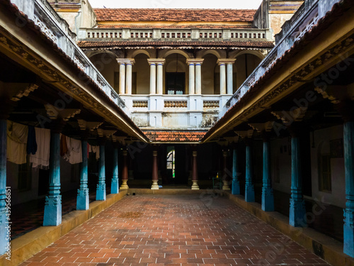Print op canvas The inner courtyard lined with wooden pillars and columns of a heritage house in a Chettinadu village