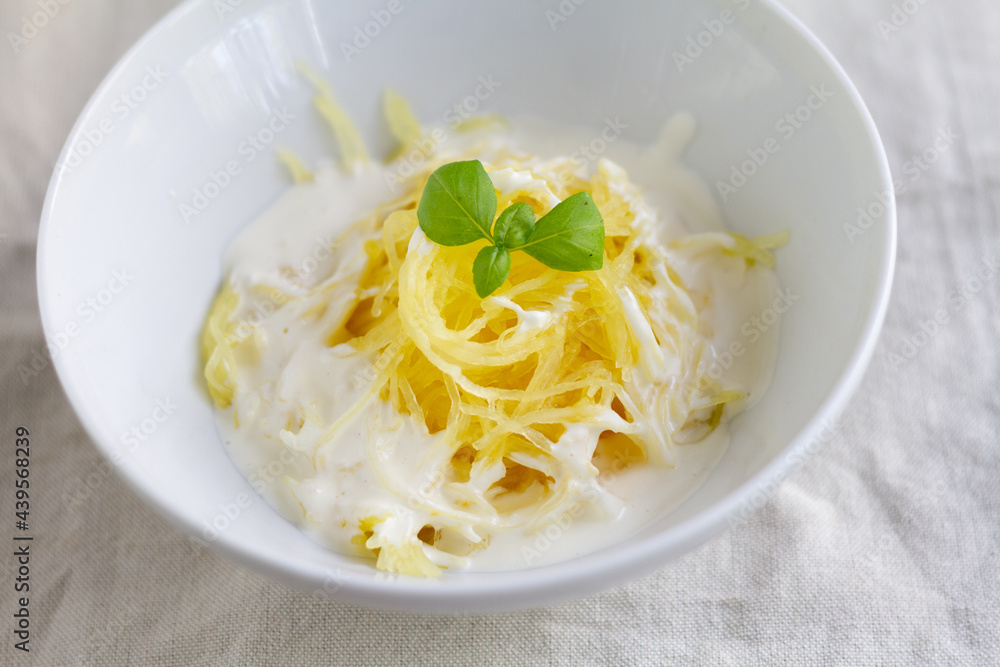 Spaghetti squash with cream cheese sauce topped with basil Spaghetti squash with cream cheese sauce topped with basil