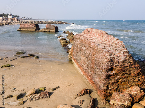 The ruins of the walls of Fort Dansborg leading to the sea in the ancient Danish colony of Tranquebar. photo