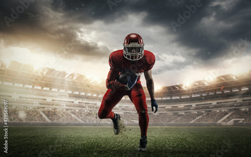 Young man american football player at stadium in motion. Action  activity  sportlife concept. Flyer for ad  design.