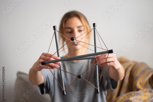 Teenager holding a tensegrity model photo