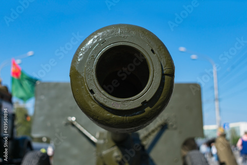 Barrel of an old artillery cannon close-up on a background of the sky. Old military equipment participating in various conflicts