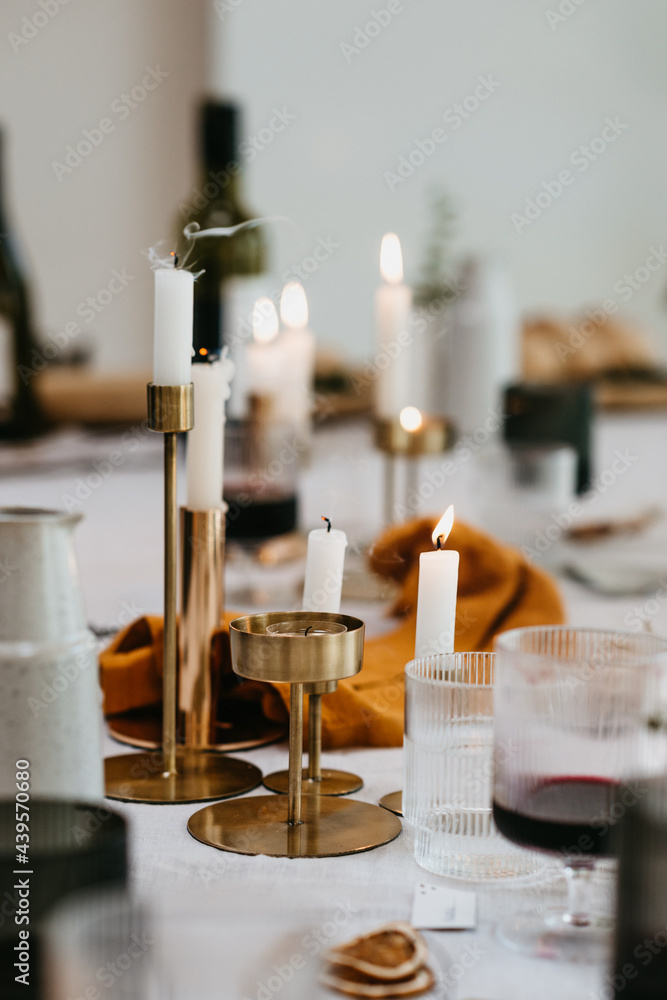 Close up of candles blown out on a festive dinner table Close up of candles blown out on a festive dinner table