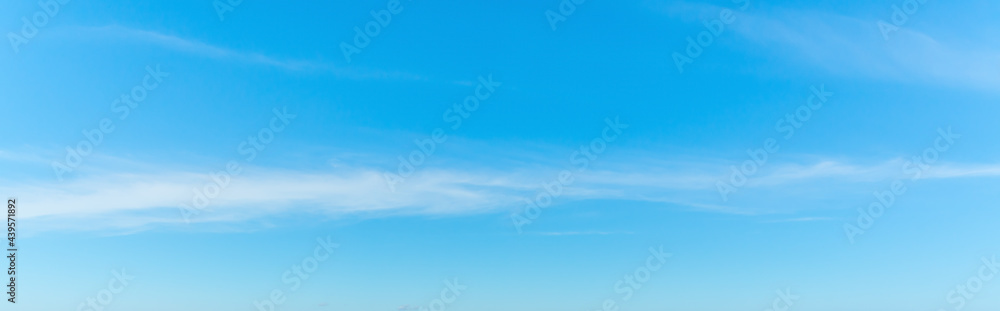 Blue sky with small white clouds