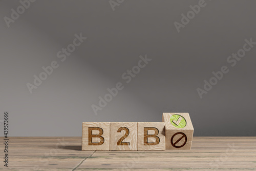 Wood cubes with acronym 'B2B' - 'Business to Business' on a beautiful wooden table, studio background. Business concept and copy space.