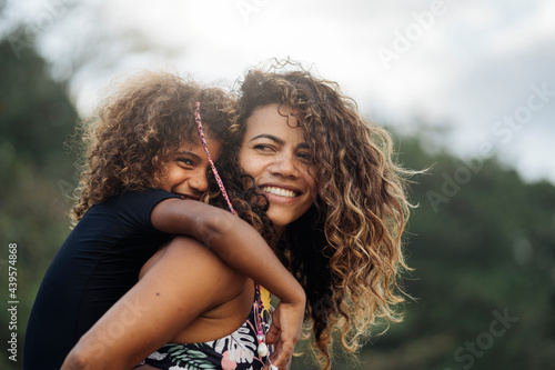 Happy Mom and Daughter in the Beach photo