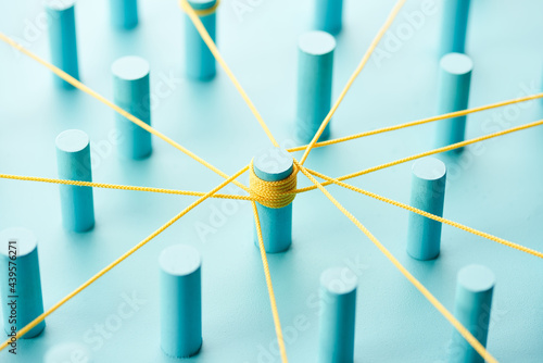 Unconnected pegs around center of network photo