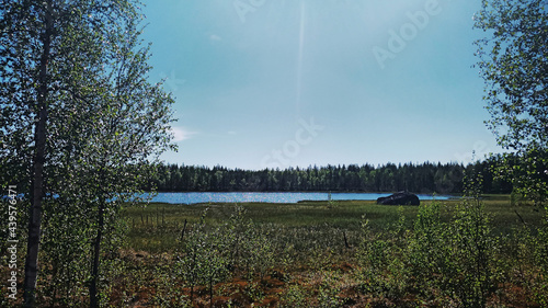 Small summerly lake and blue sky in Swedish Lapland photo