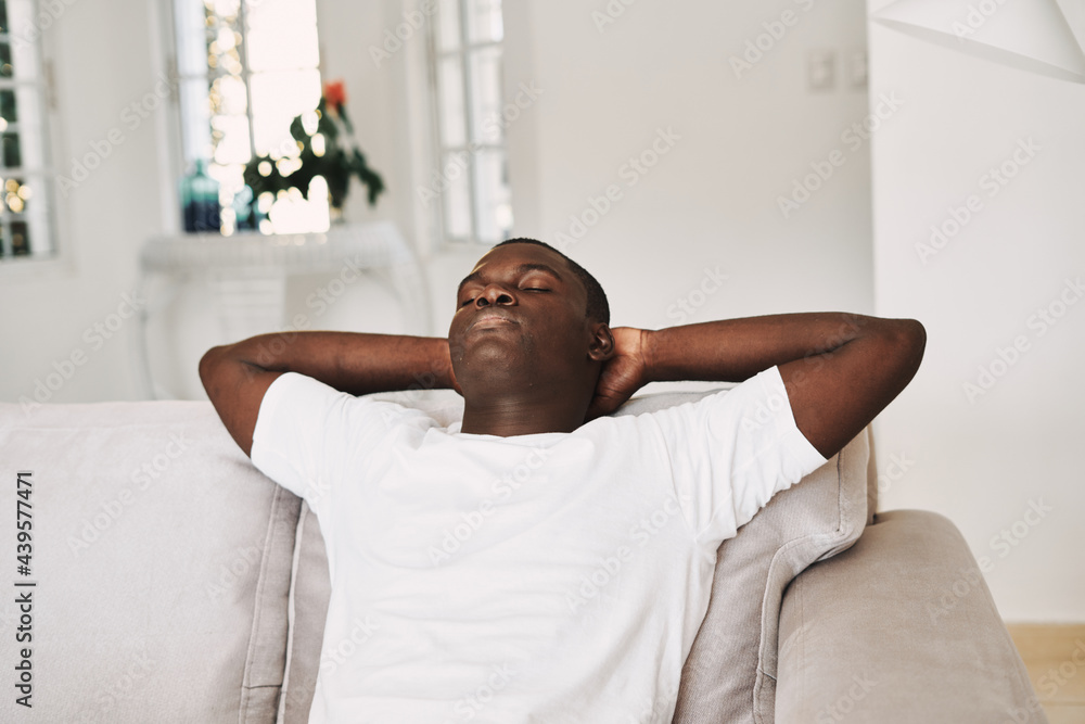 man african appearance at home resting on the couch weekend man african appearance at home resting on the couch weekend