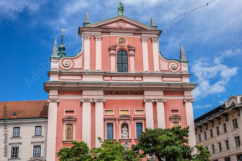 Franciscan Church of Annunciation (1646 - 1660) located on Preseren Square in Ljubljana - capital of Slovenia. Its red color is symbolic of the Franciscan monastic order. photo