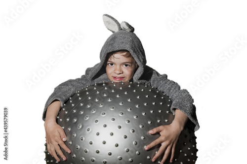 A little boy in a gray robe with bunny ears