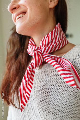 Woman wearing  striped scarf photo