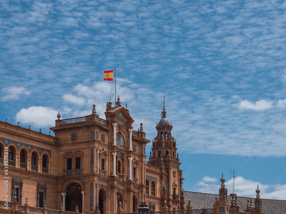 Spanish square (Plaza de Espana) in Maria Luisa park, Seville, Spain, with the Spanish flag on the facade