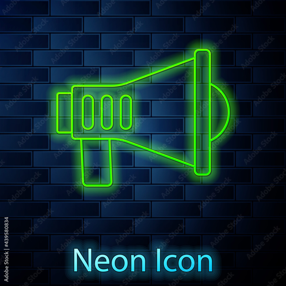 Glowing neon line Megaphone icon isolated on brick wall background. Speaker sign. Vector