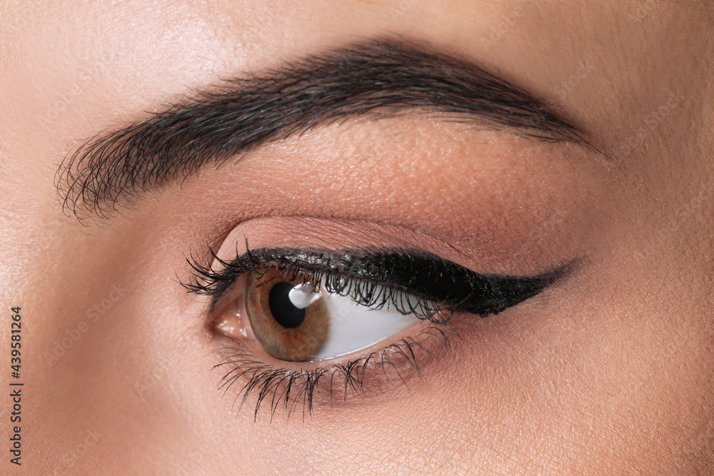 Beautiful woman with black eyeliner, closeup view Beautiful woman with black eyeliner, closeup view