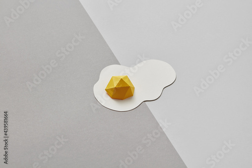 Flatlay of papercraft yellow egg photo