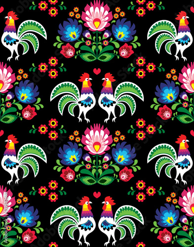 Seamless Polish folk art pattern with roosters and flowers - Wzory Lowickie, wycinanka, traditional ethnic textile or fabric print on black background
