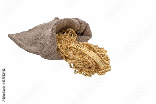 .Gold jewelry was poured out of the bag stacks together