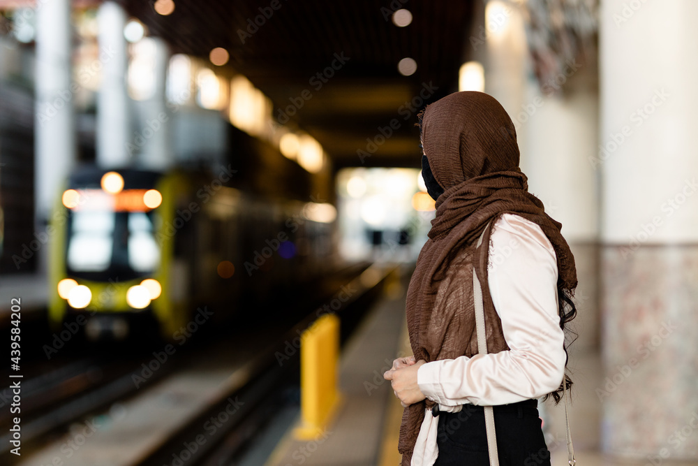 Muslim Woman Looking at Train Muslim Woman Looking at Train