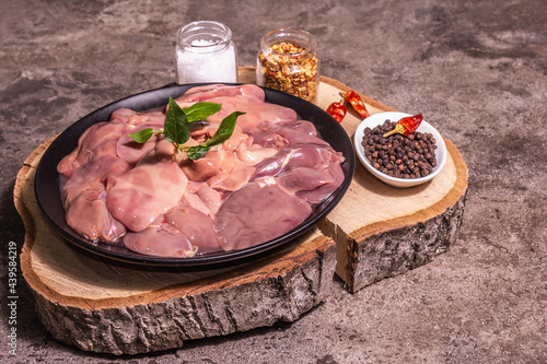 Raw chicken liver with spice set ready for cooking photo