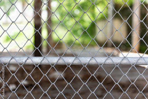 Steel mesh is used as a fence. Strong and resistant to weather.
