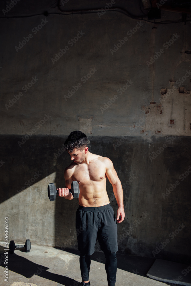 young man training in his garage young man training in his garage