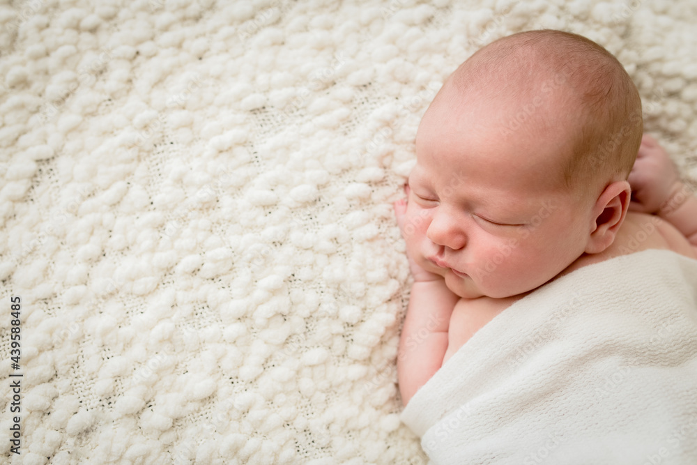 Baby asleep on textured blanket Baby asleep on textured blanket