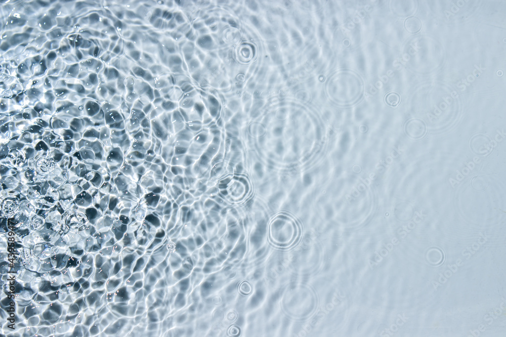 Circle ripples on water surface. Ripples on the water background. Pure clear water