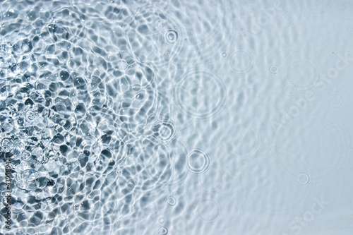 Circle ripples on water surface. Ripples on the water background. Pure clear water