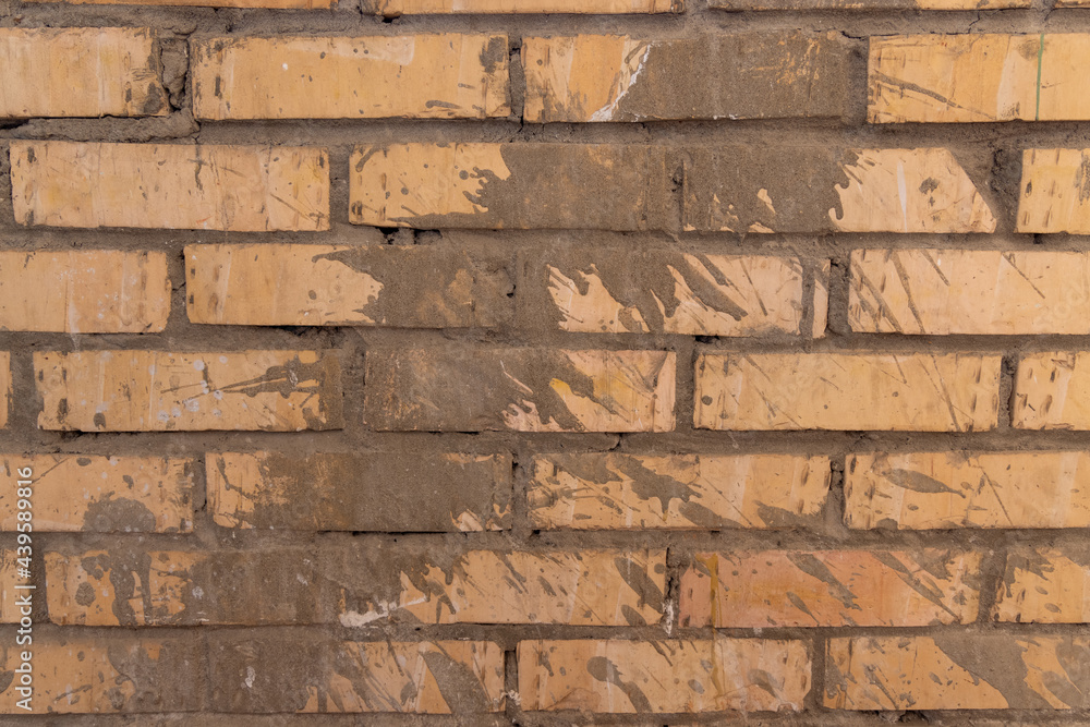 Old dirty brick wall with traces of cement Old dirty brick wall with traces of cement